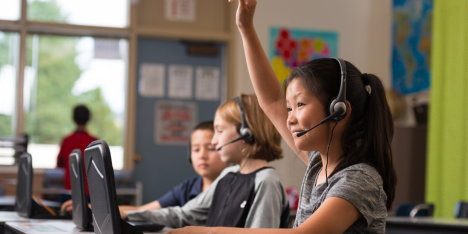 A group of children using computers